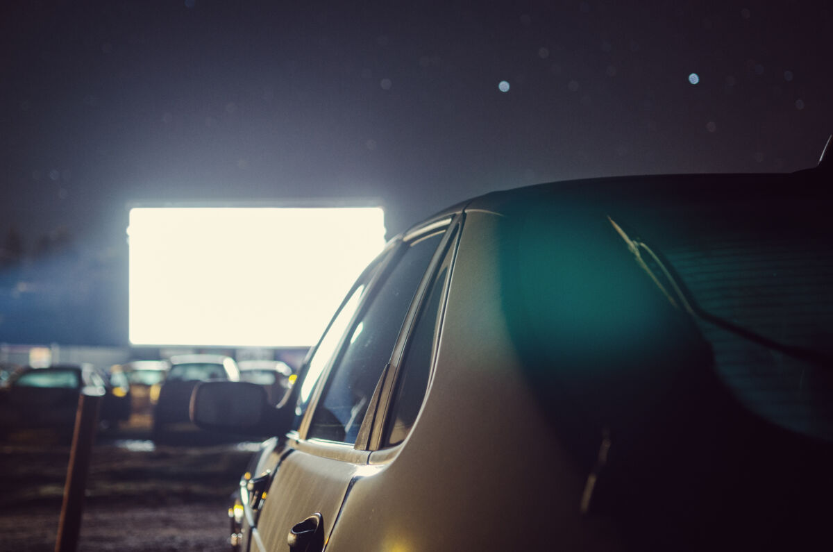 Car at a drive-in movie theater