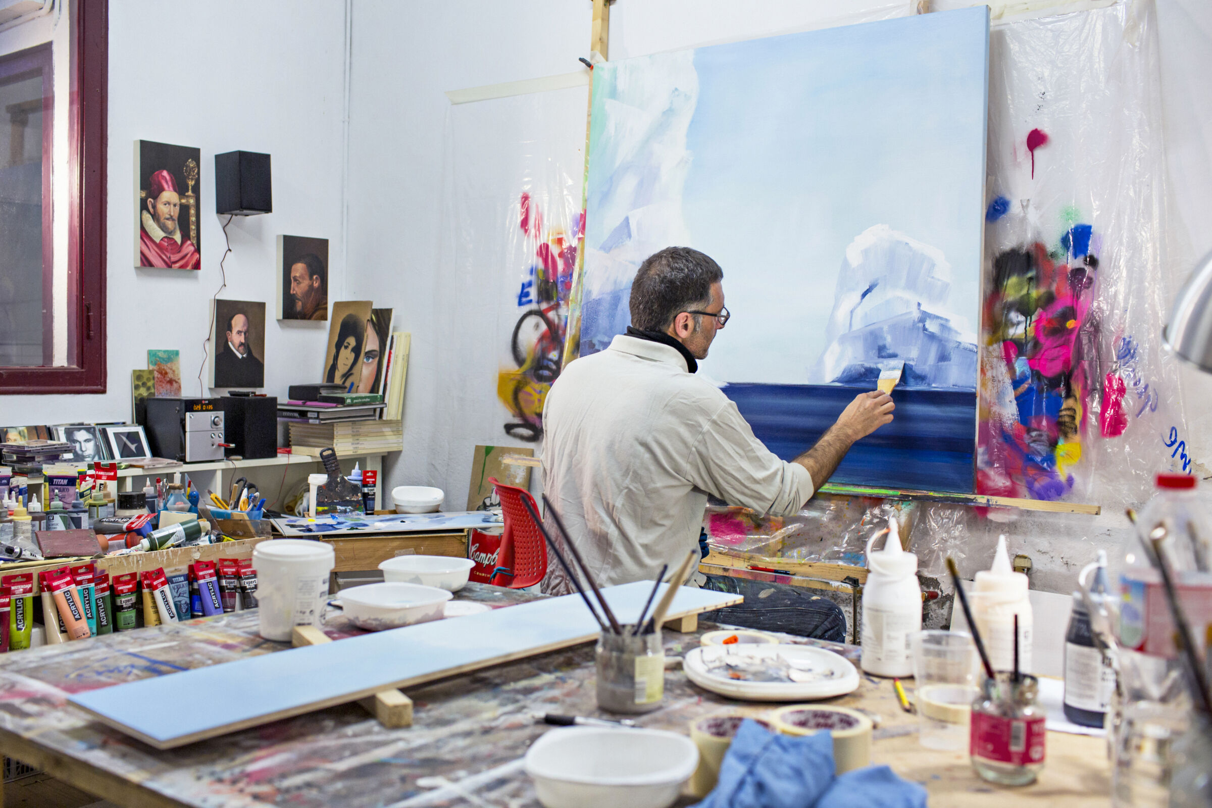 Artist painting in a studio