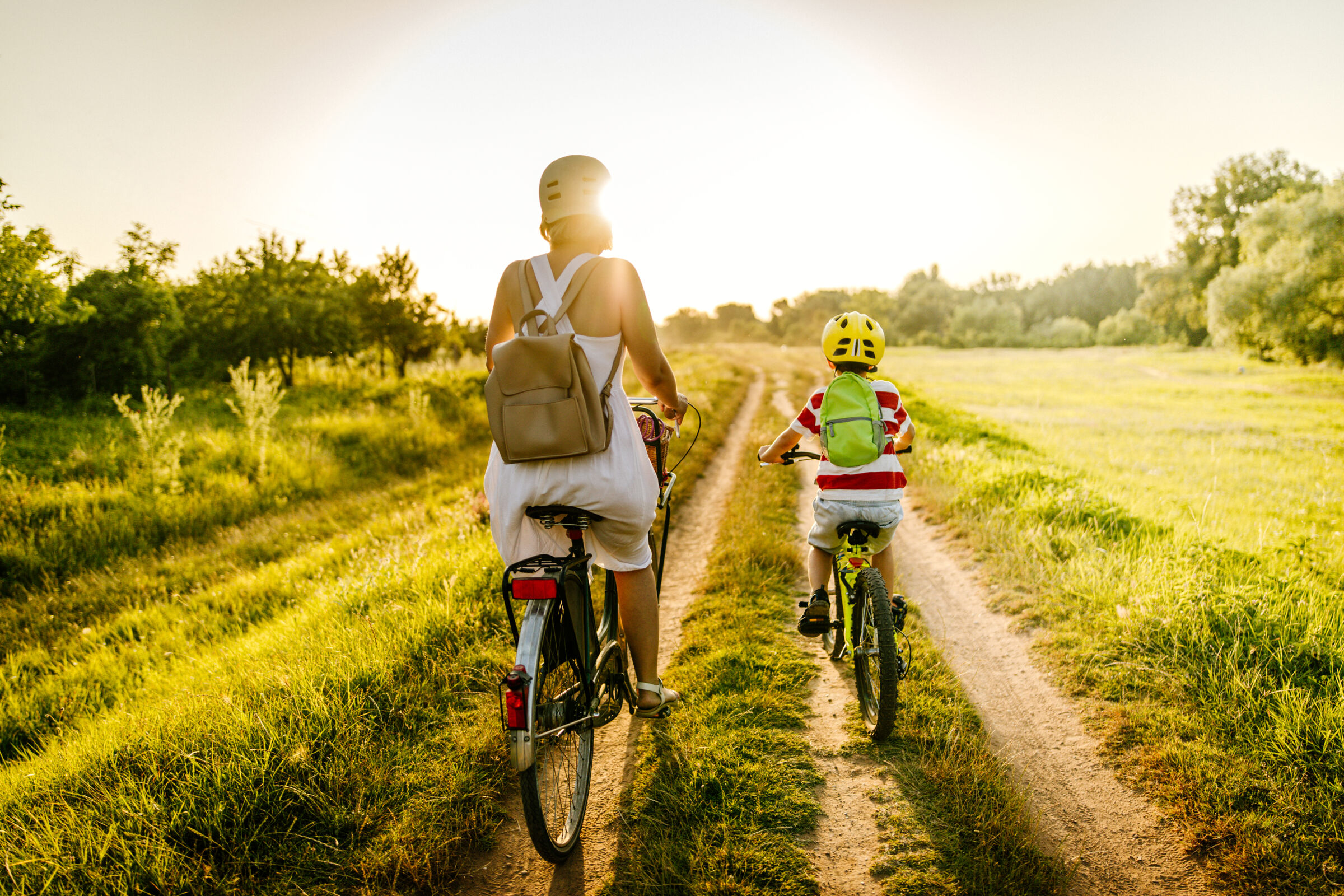 Mother and child biking in nature