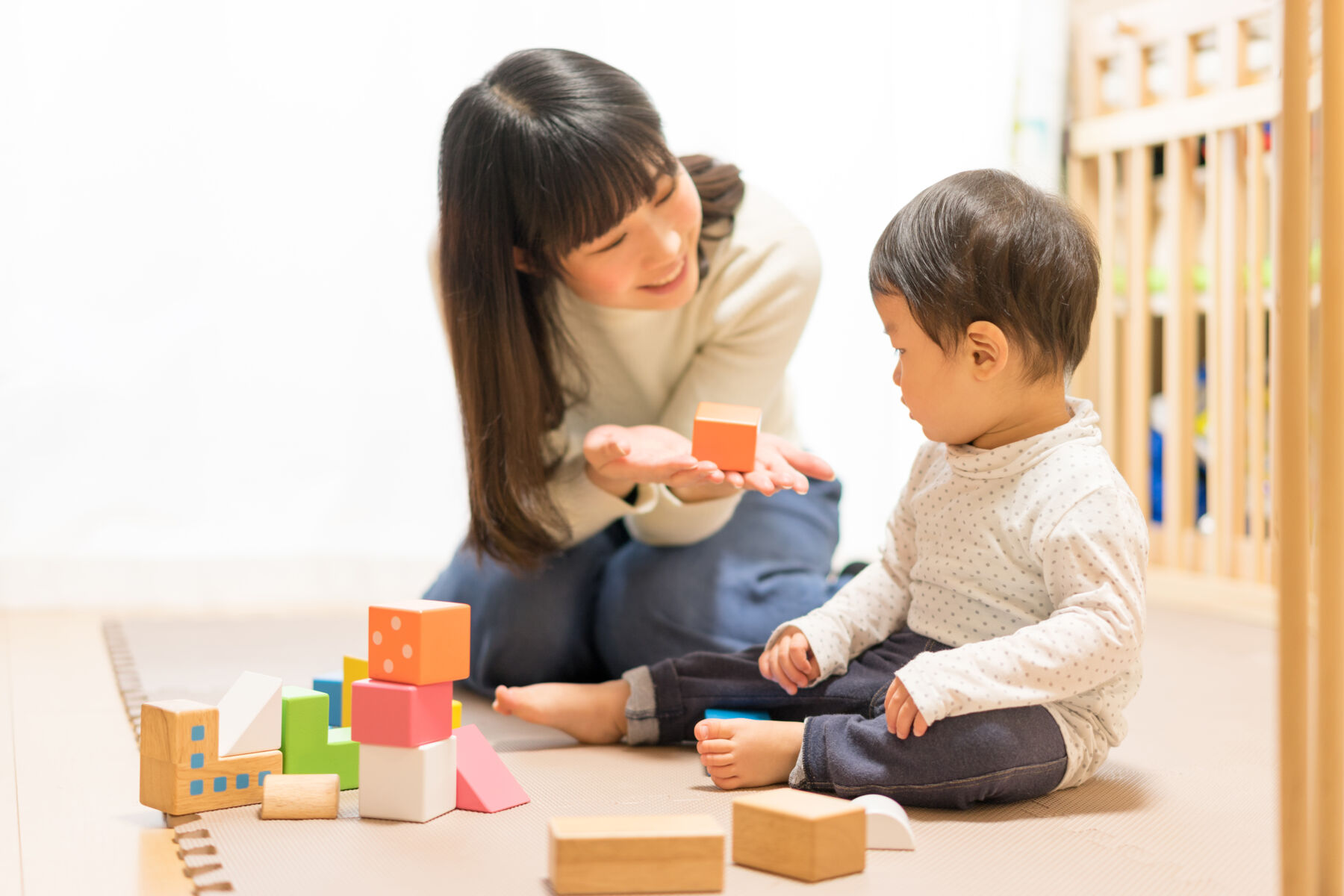 Mother and son playing with blocks