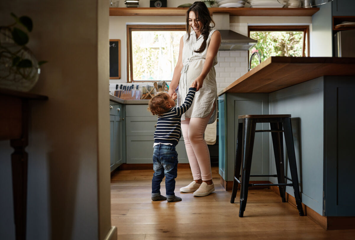 Mother and child dancing in the kitchen