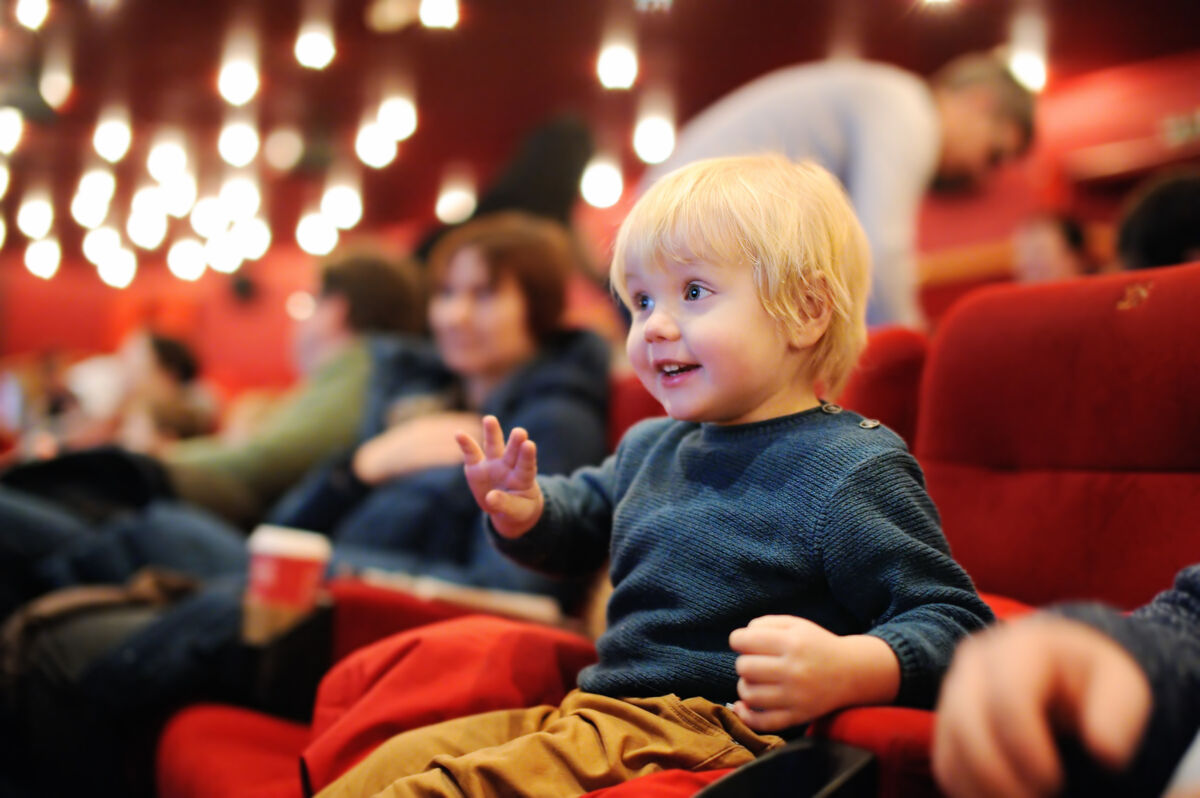 Toddler watching a show in a theater