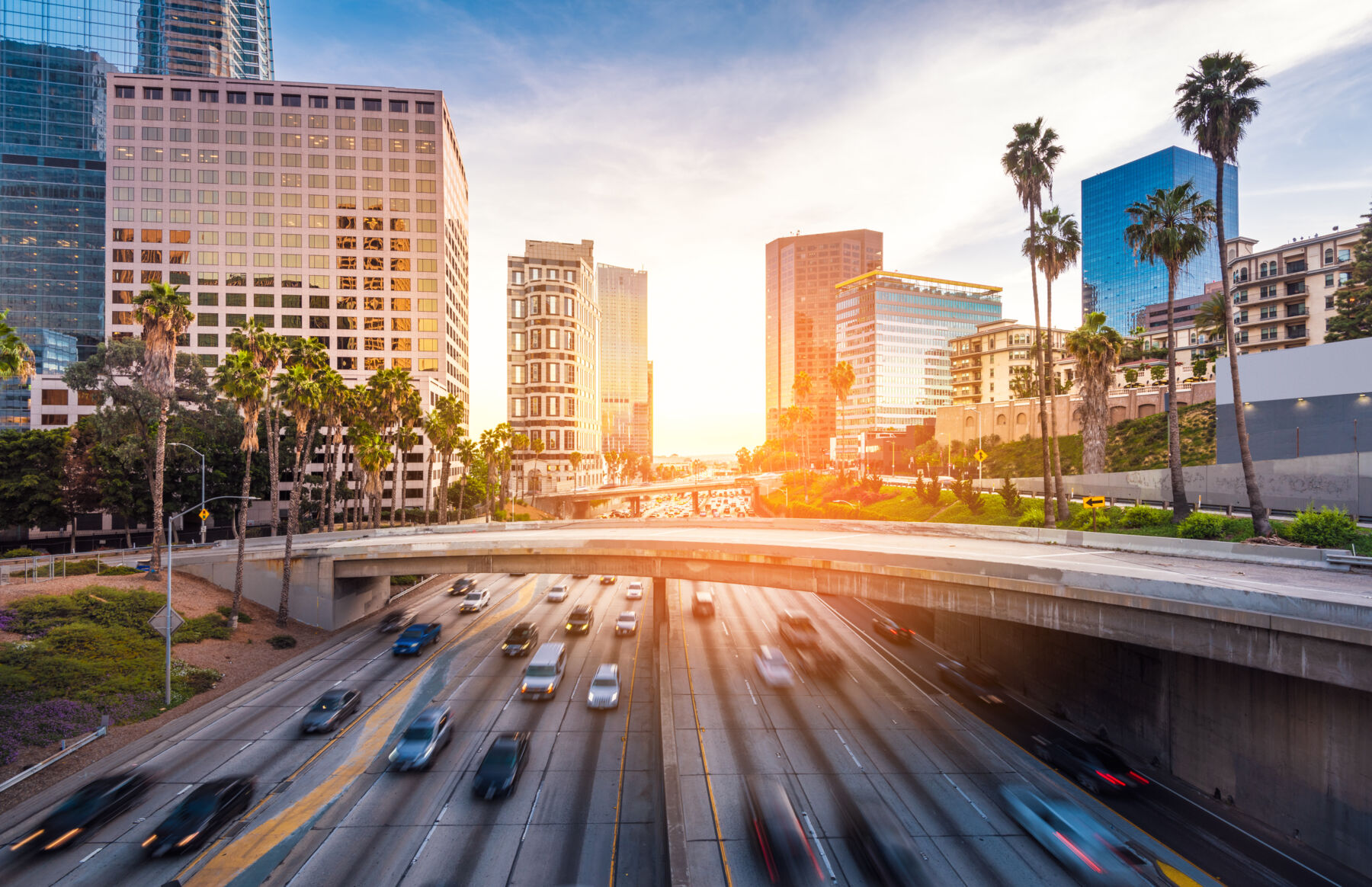 City and highway at sunset