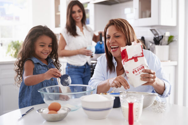 Mom, child, and grandma baking