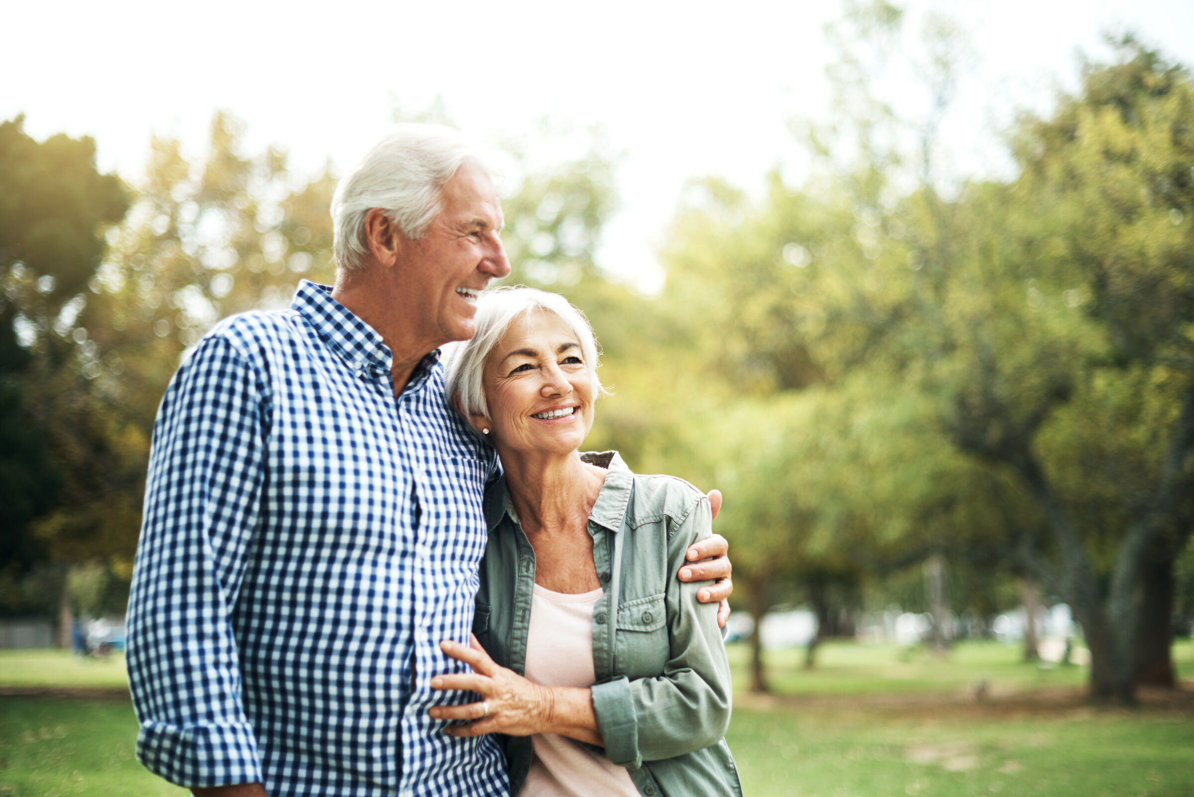 Senior couple hugging in a park