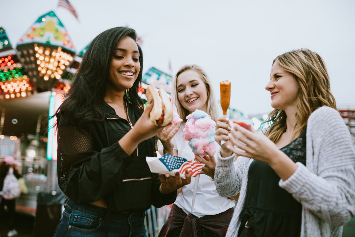 Friends eating at a festival