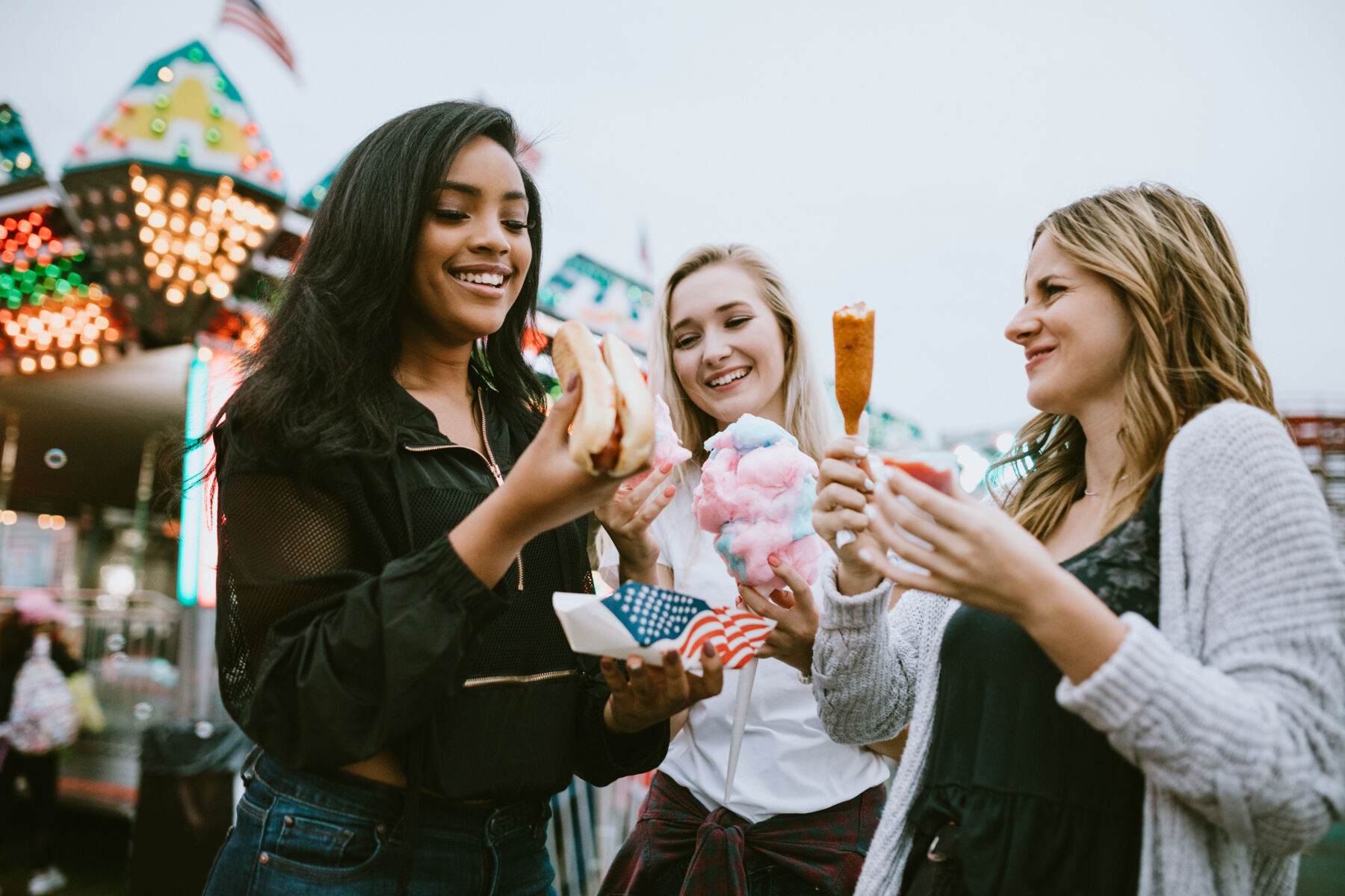 Friends eating at a festival