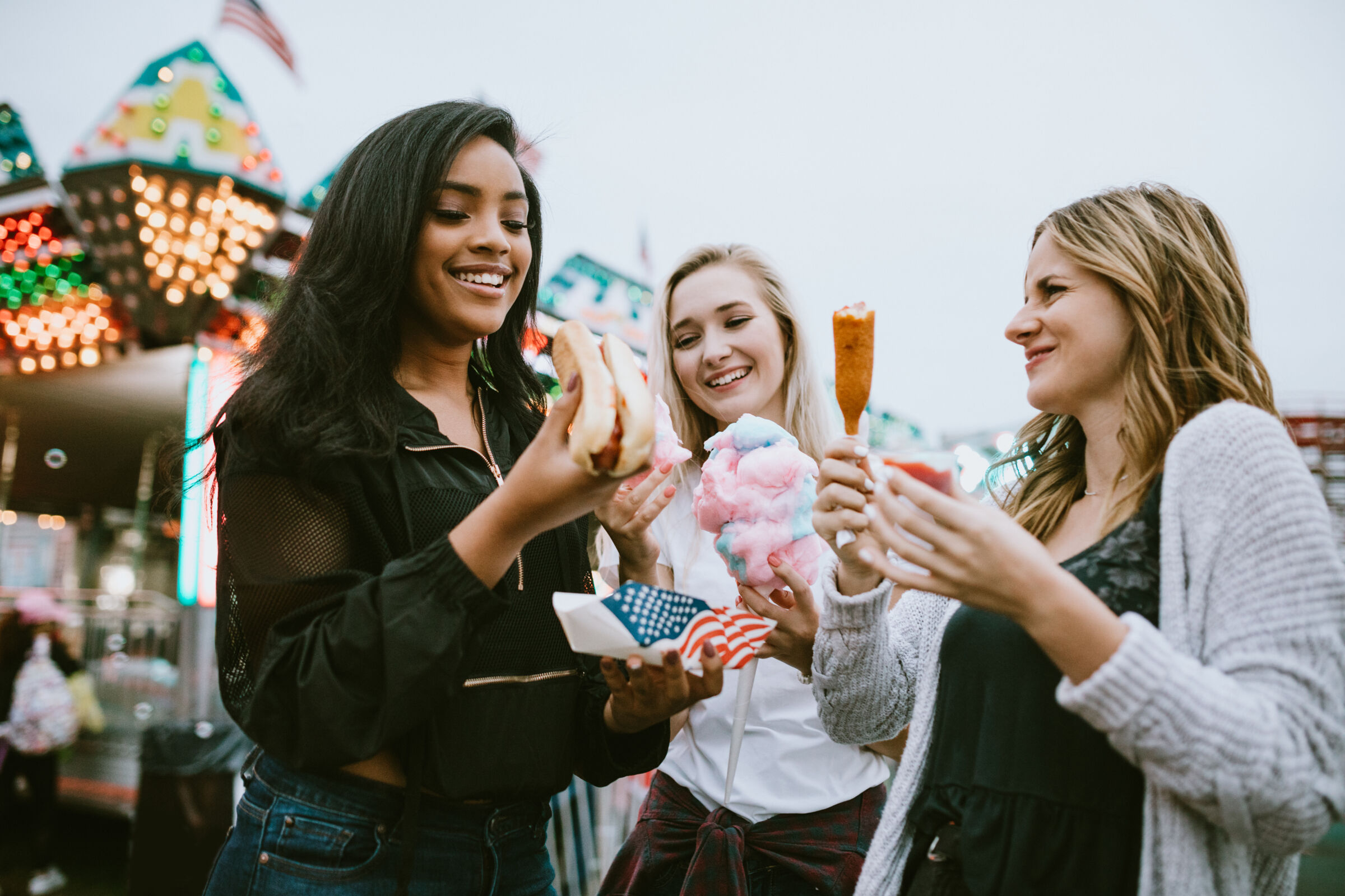 Friends eating at a festival