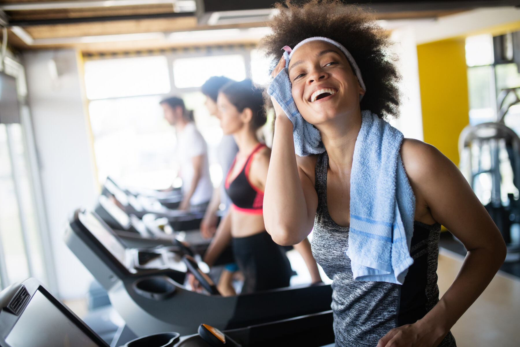 Woman exercising on a treadmill at a gym