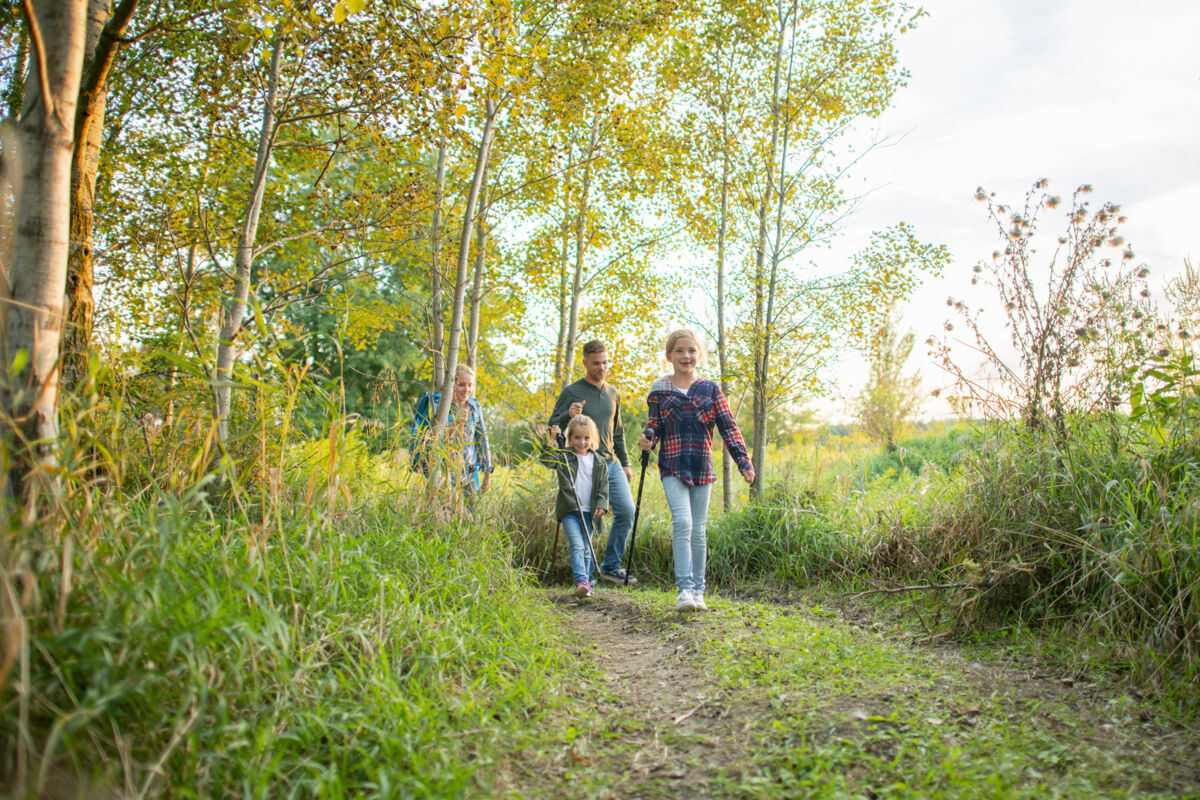 Family hiking along a path
