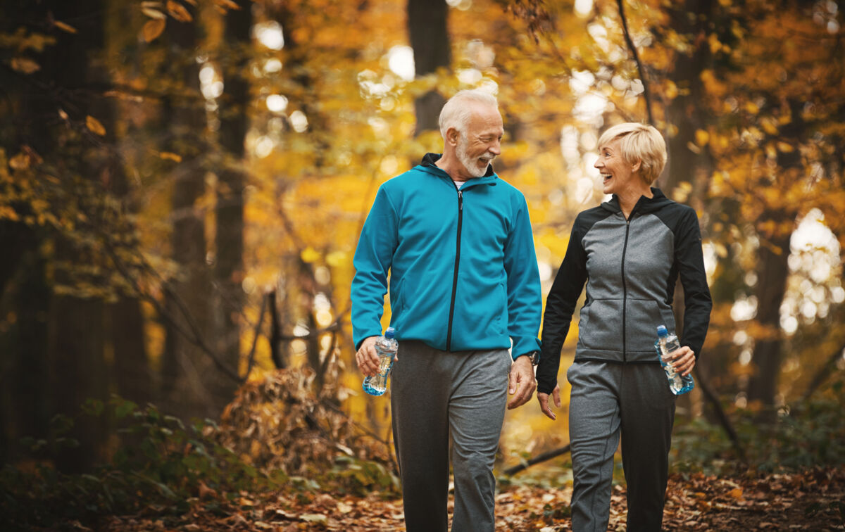 Senior couple hiking on a trail