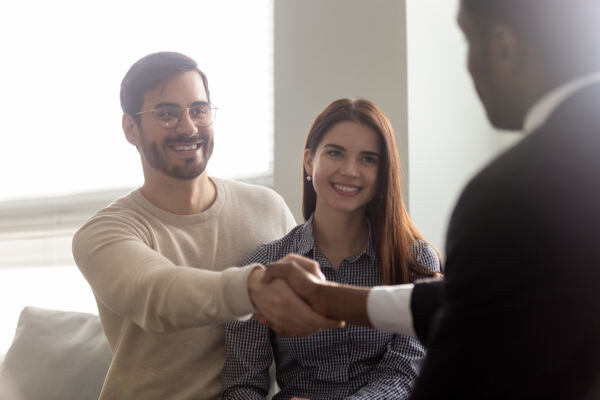 People shaking hands and smiling