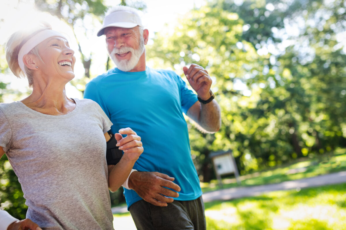 Senior couple jogging in a park