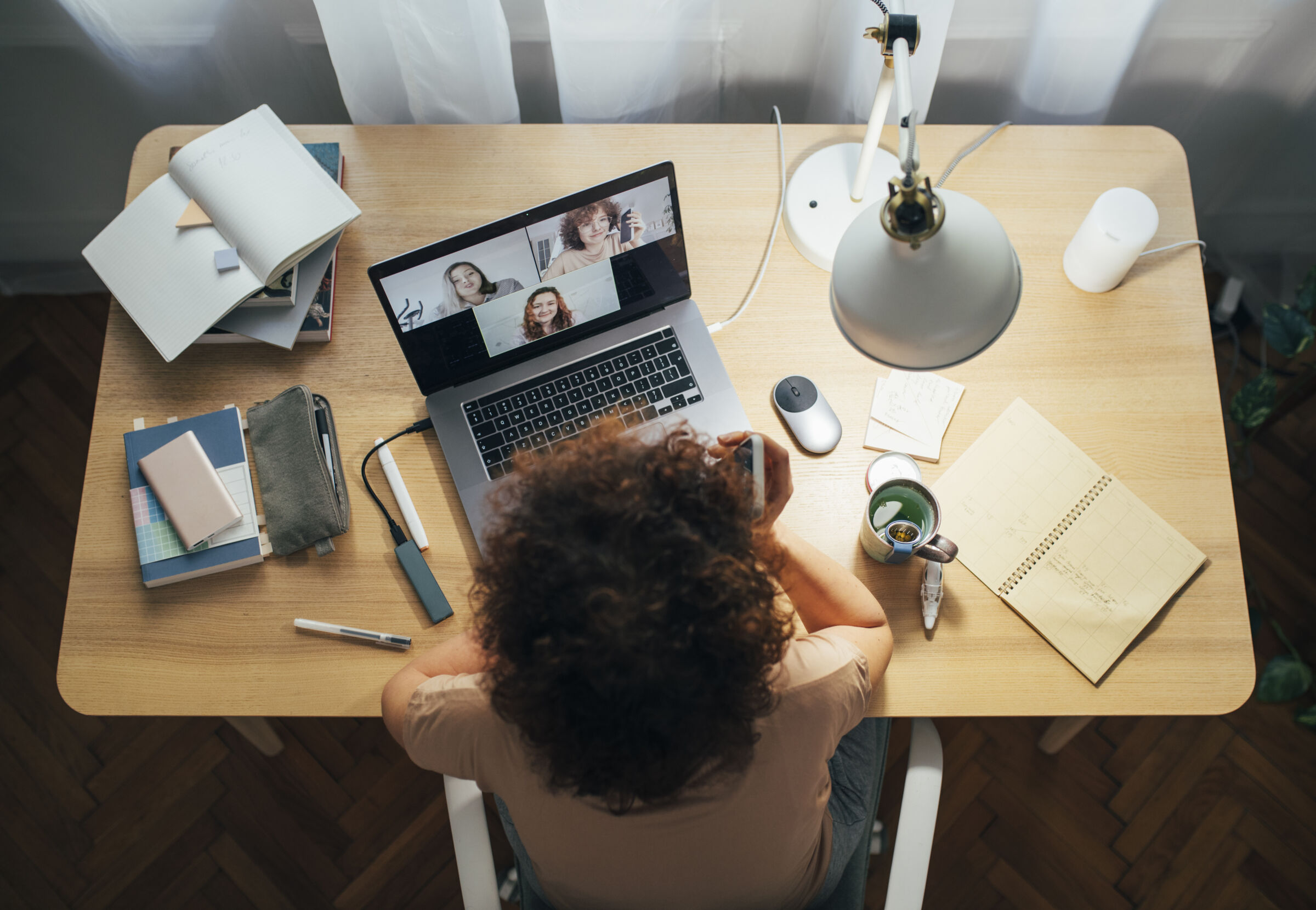 Woman working from home, on a video call