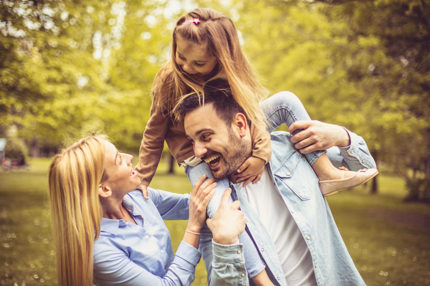 Family playing in a park