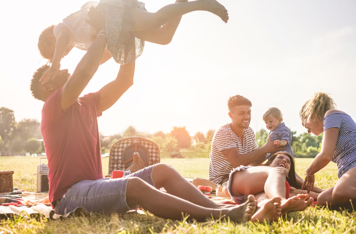 Family and friends having a picnic in a park