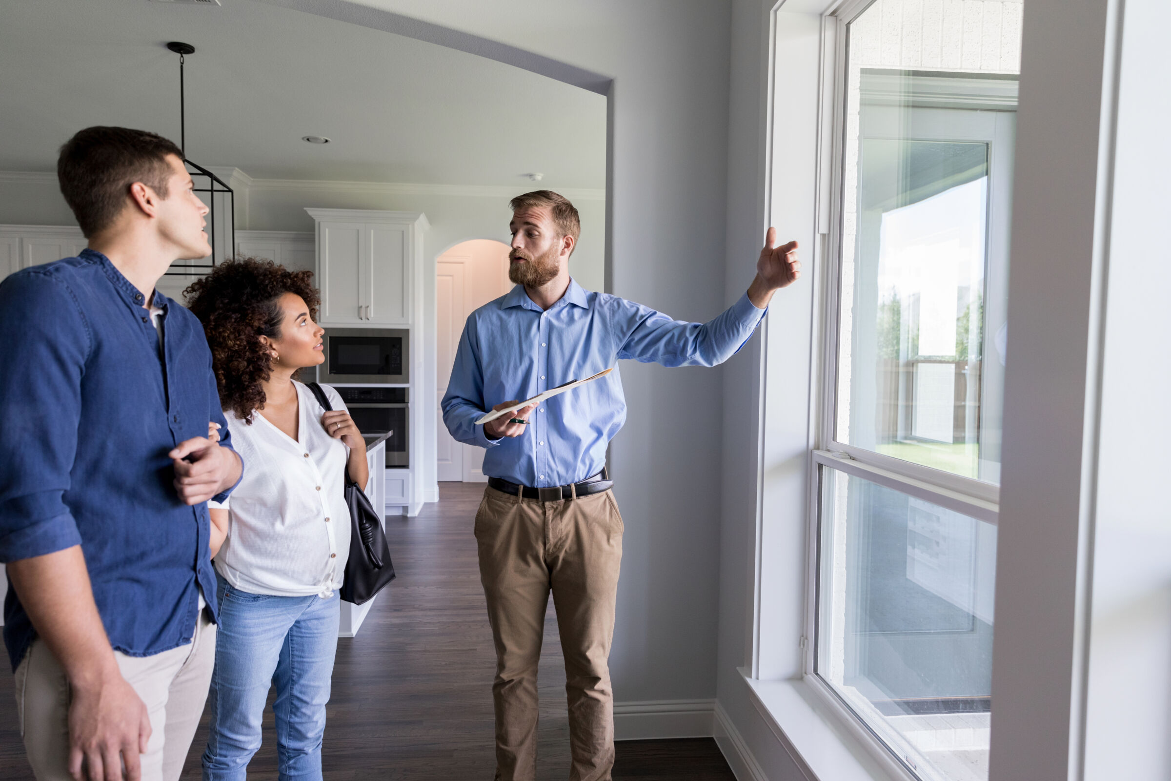 Couple taking a home tour with a real estate agent