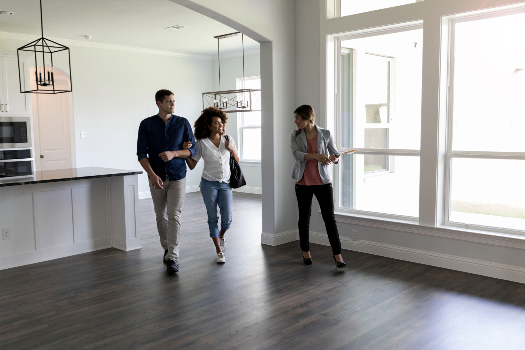 Couple taking a tour of a house