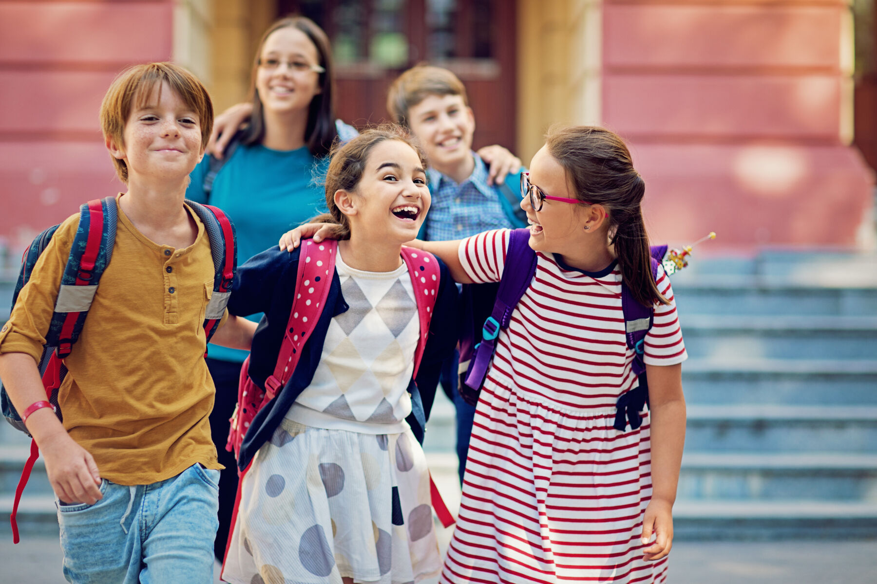 Friends on the school steps