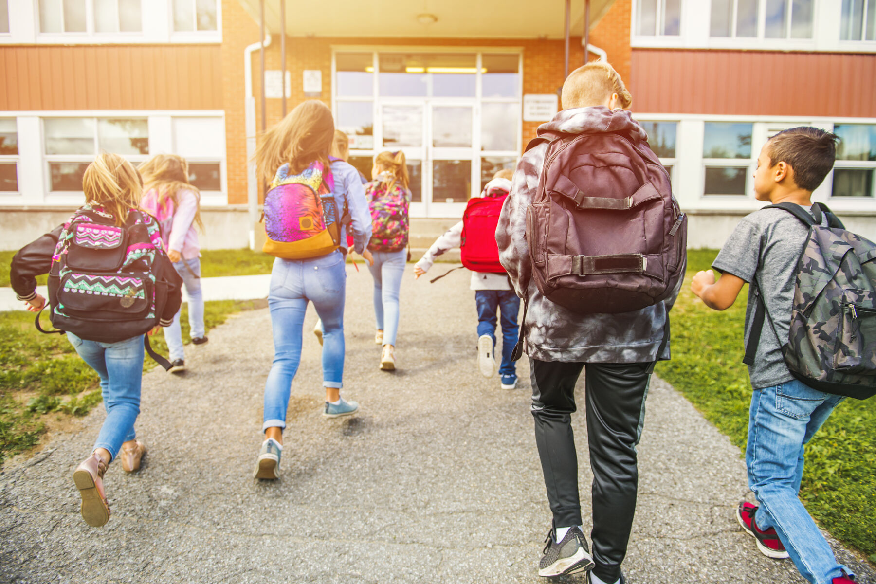 Kids running into school