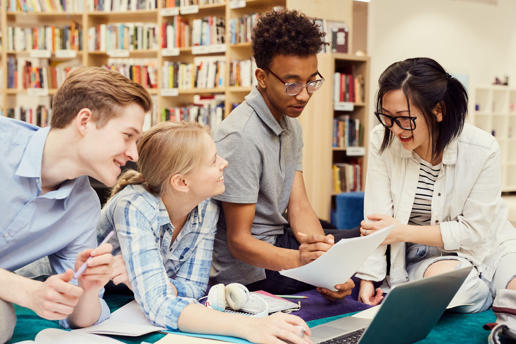 Teens studying in the library