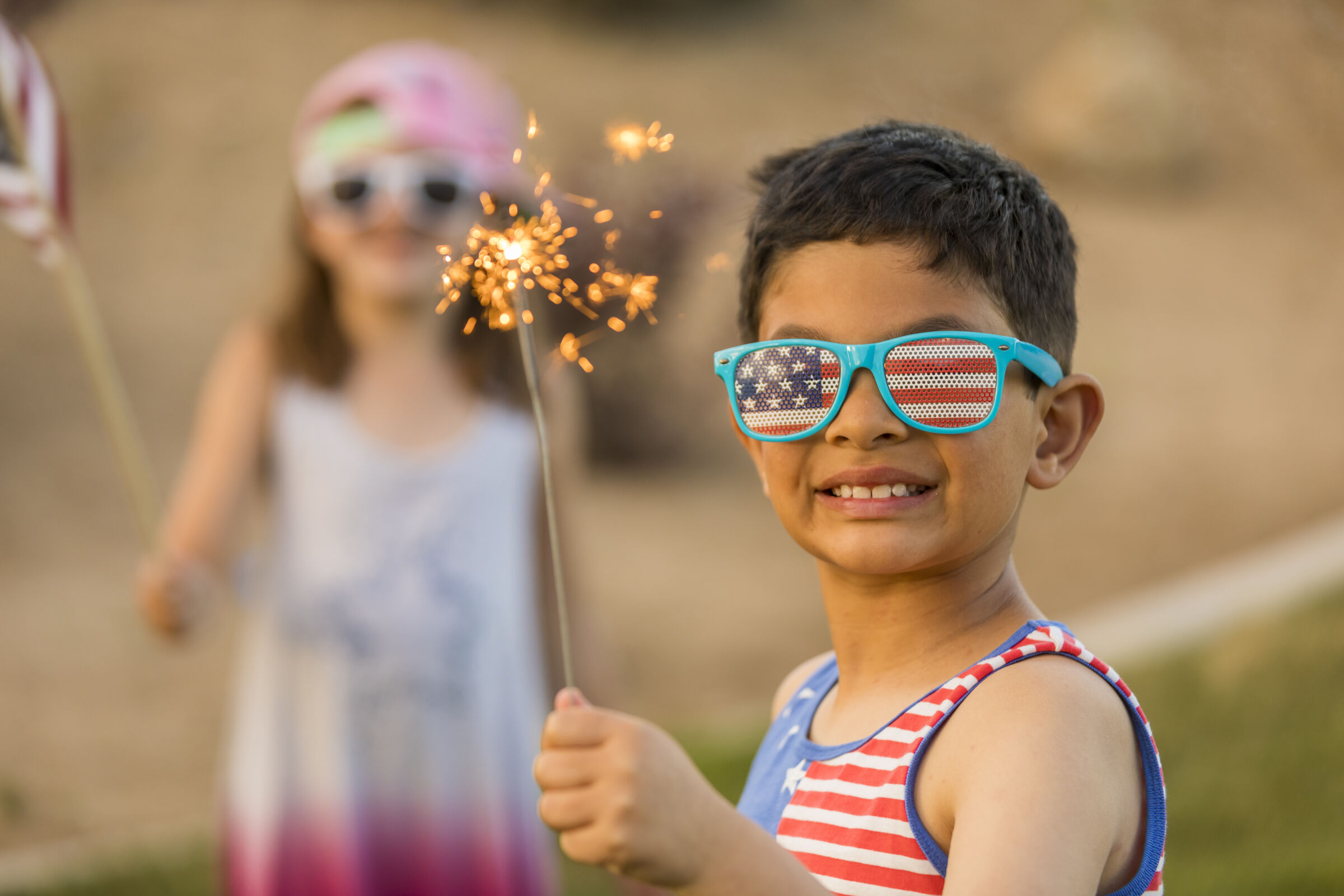 Kid with sparkler on the 4th of July