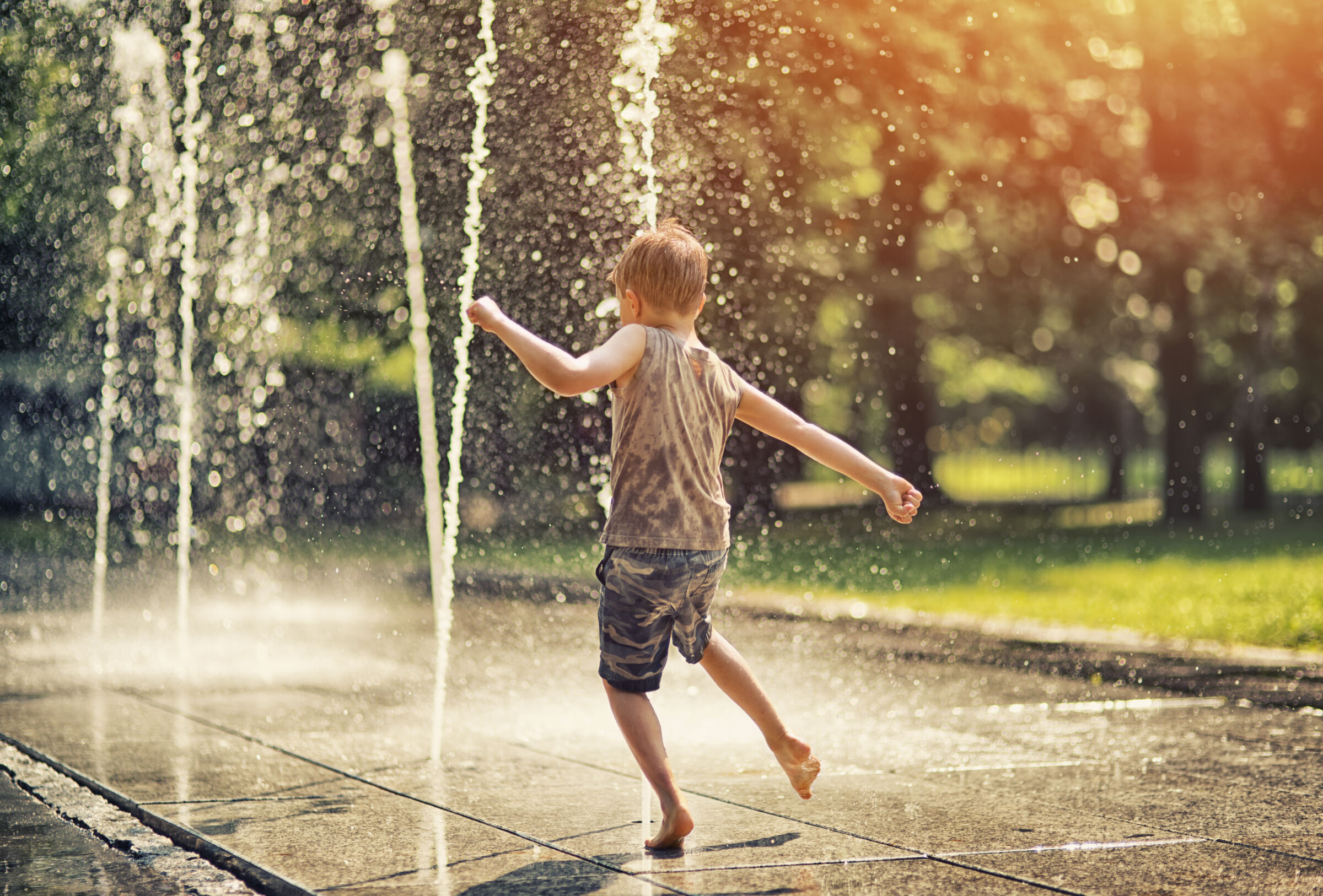 Kid Playing in Splash Pad