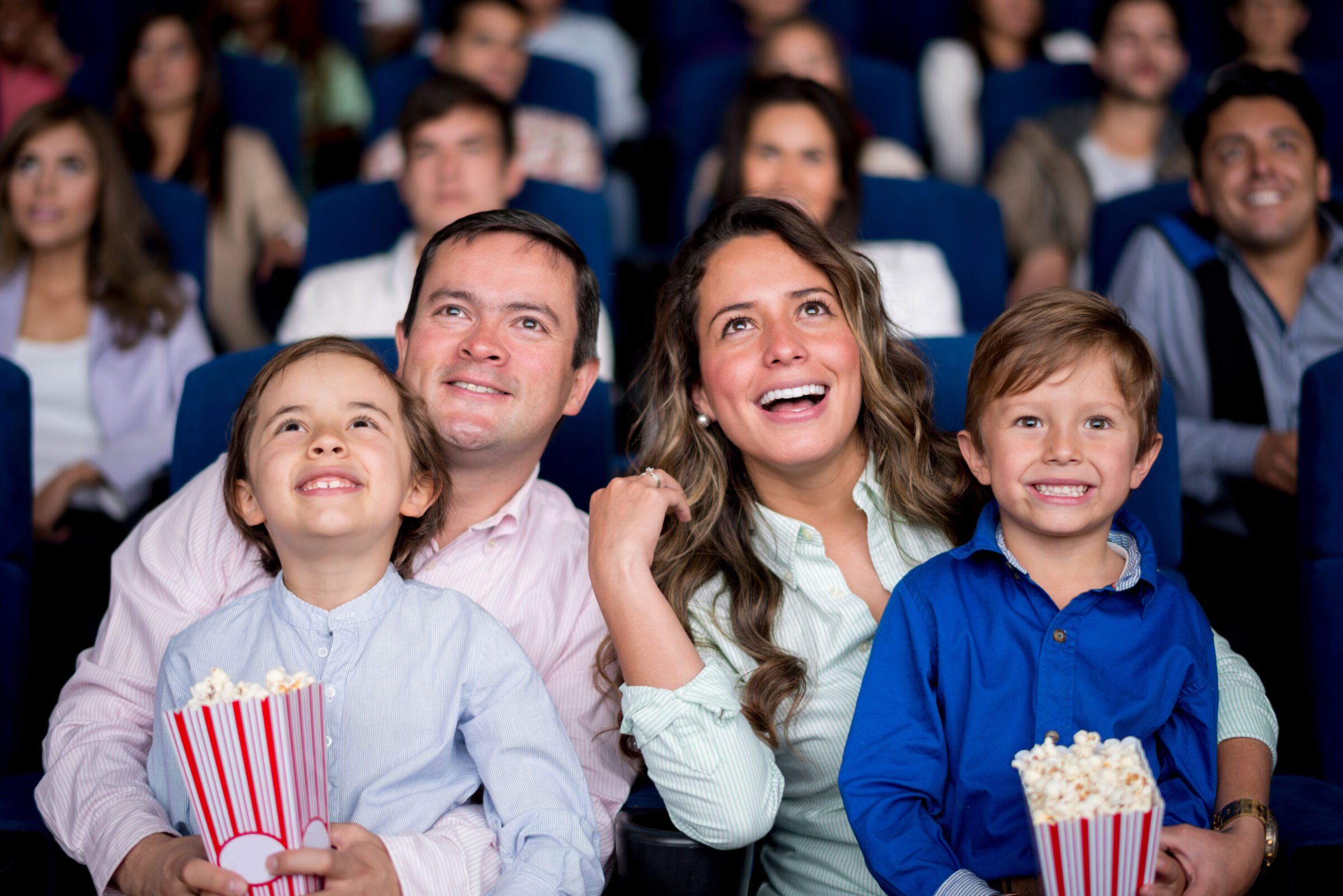 family watching movie at theater