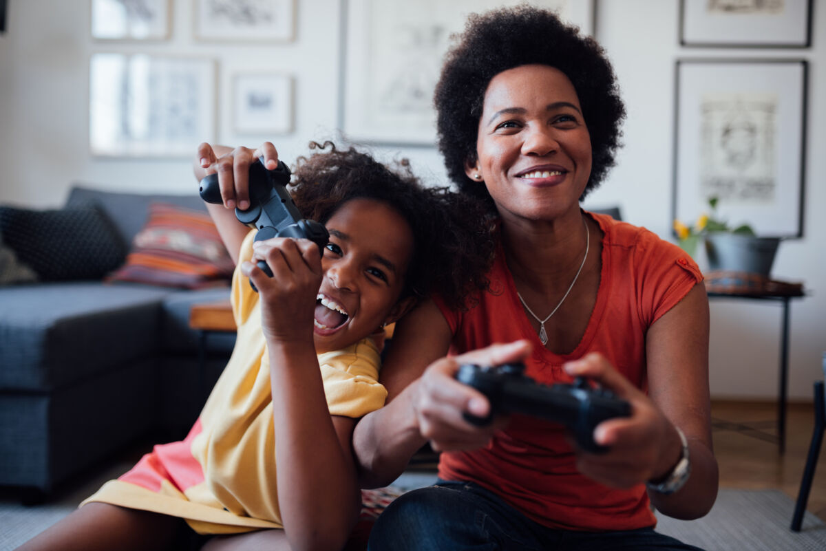 mom and daughter playing video game
