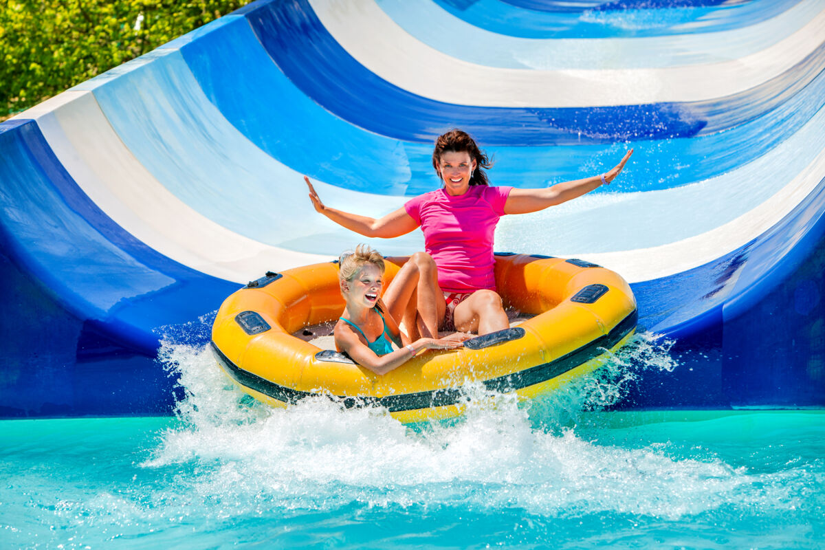 mother and daughter on waterslide tube