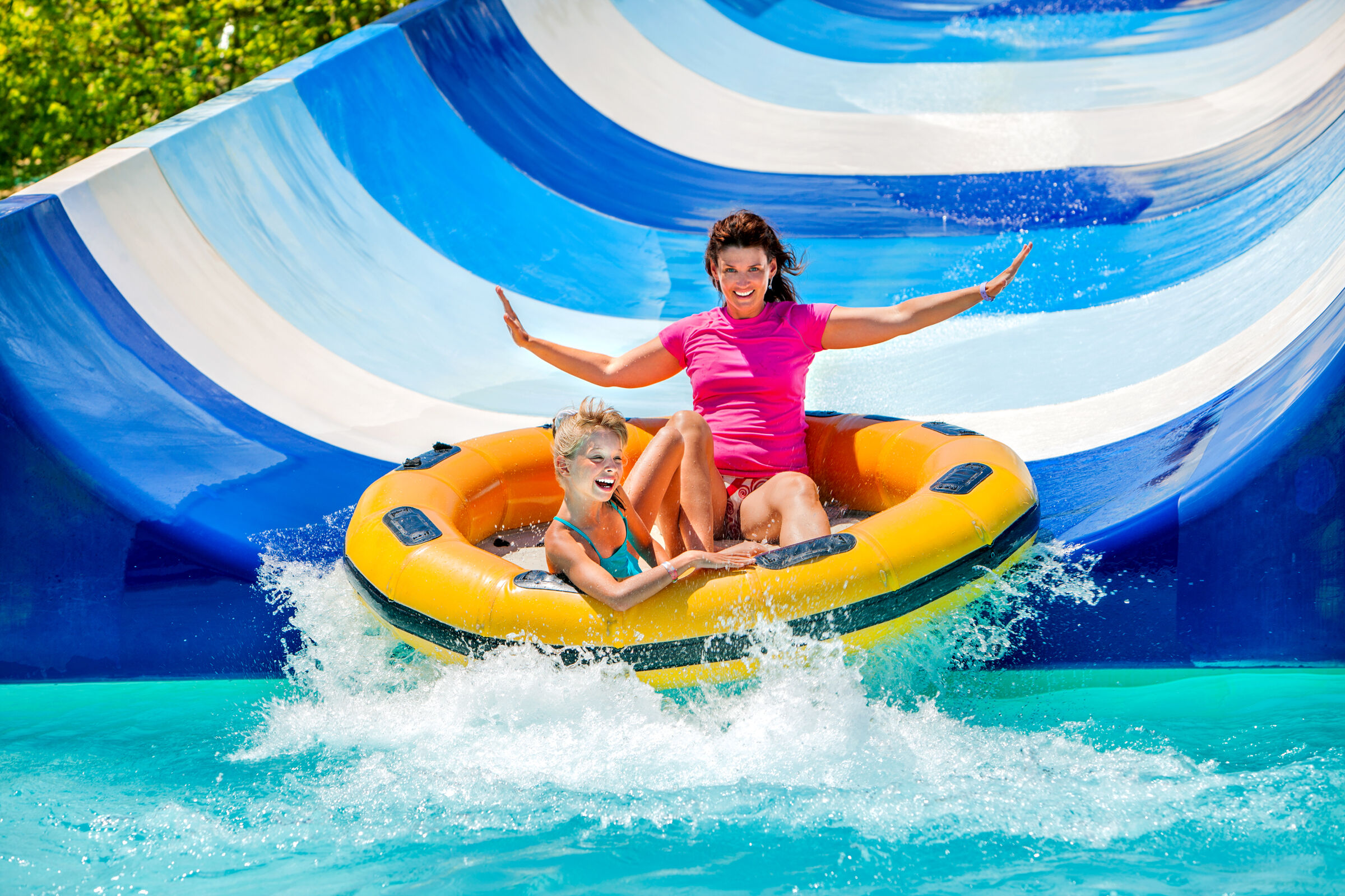 mother and daughter on waterslide tube