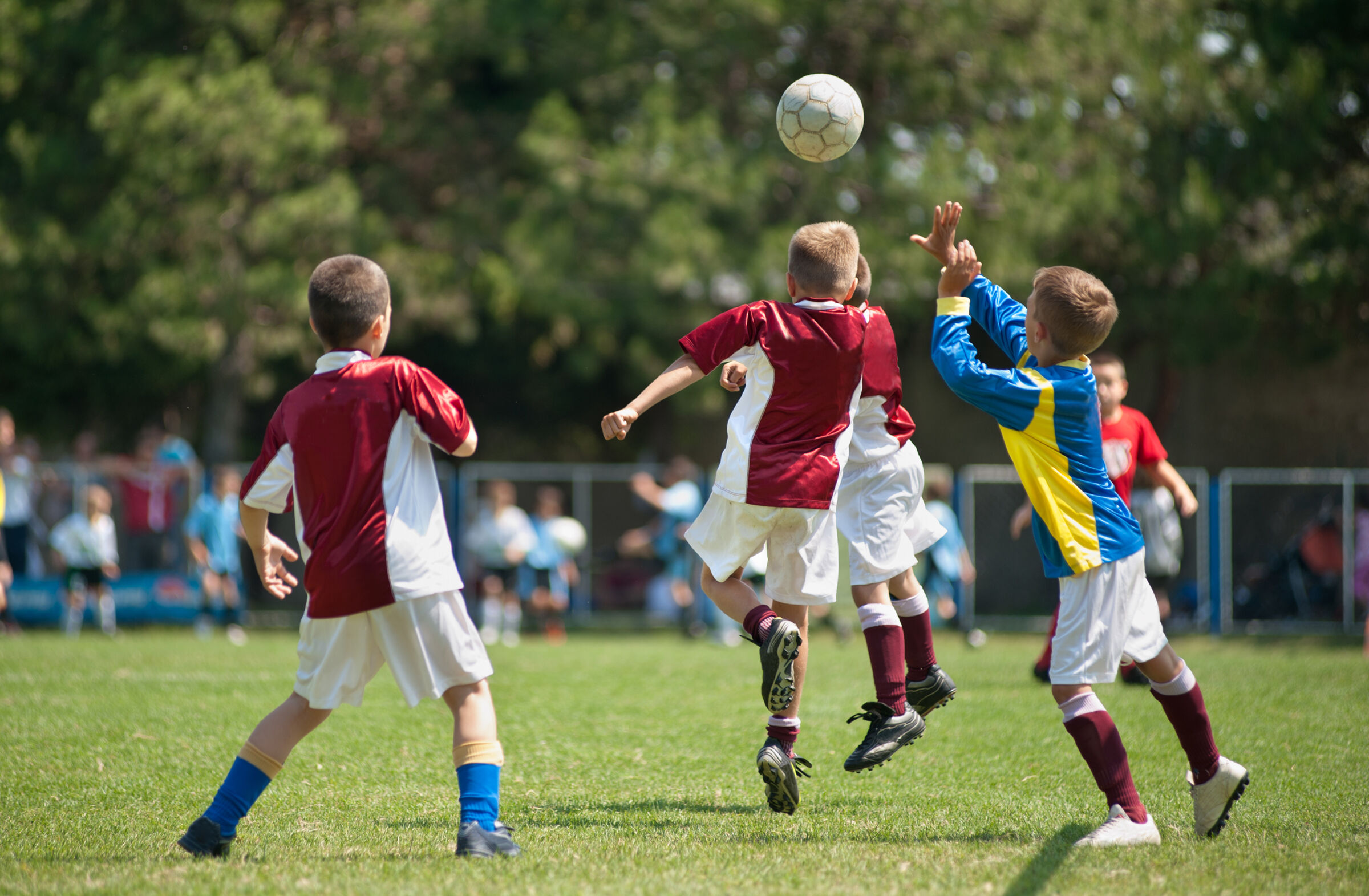 Kids (all boys) playing an organized soccer game