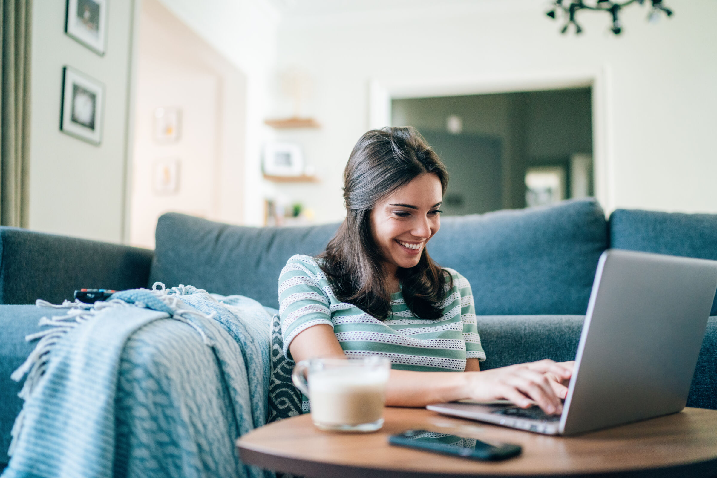 woman working from home on couch