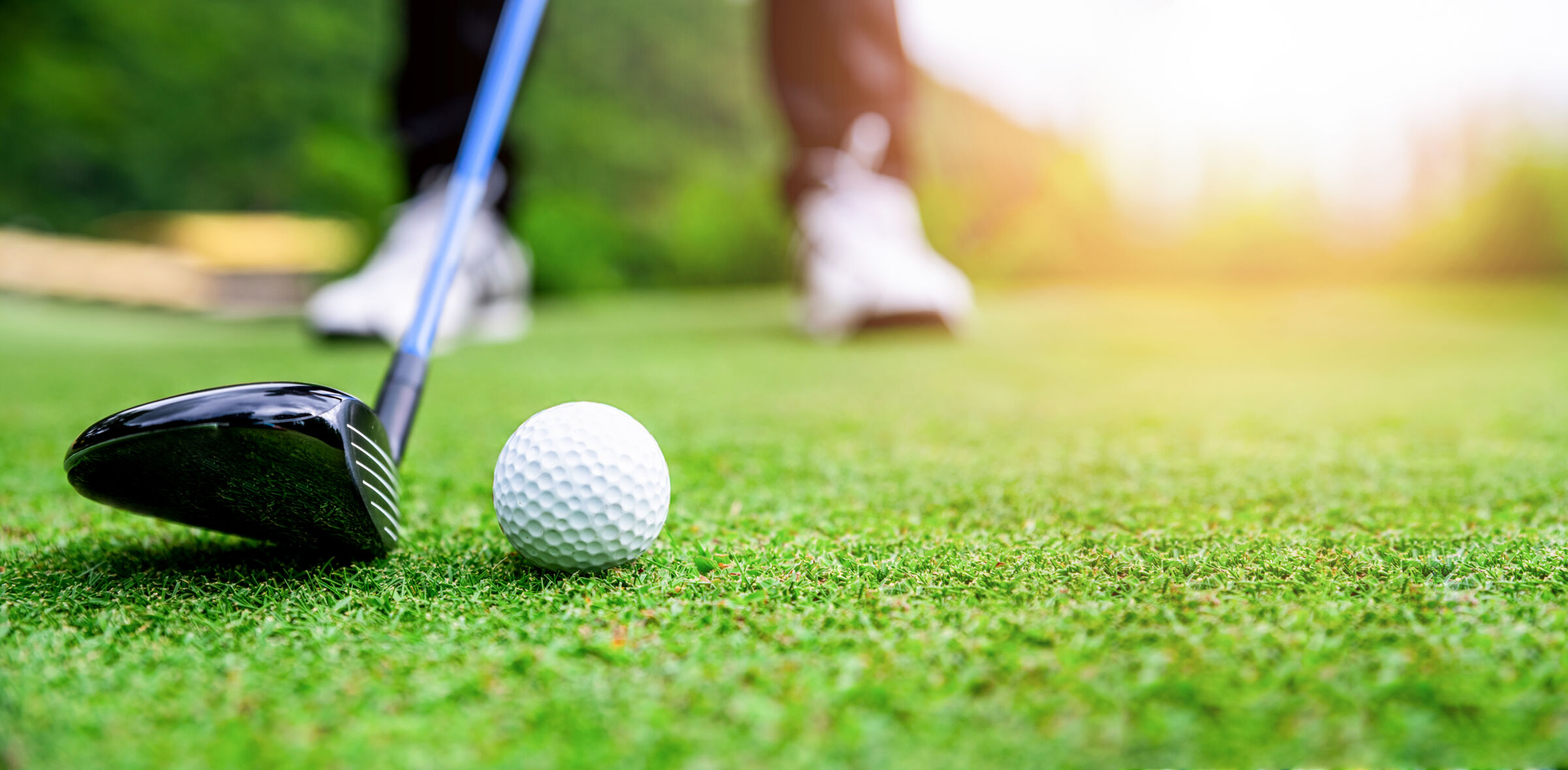 Closeup of a golfer preparing for a shot.