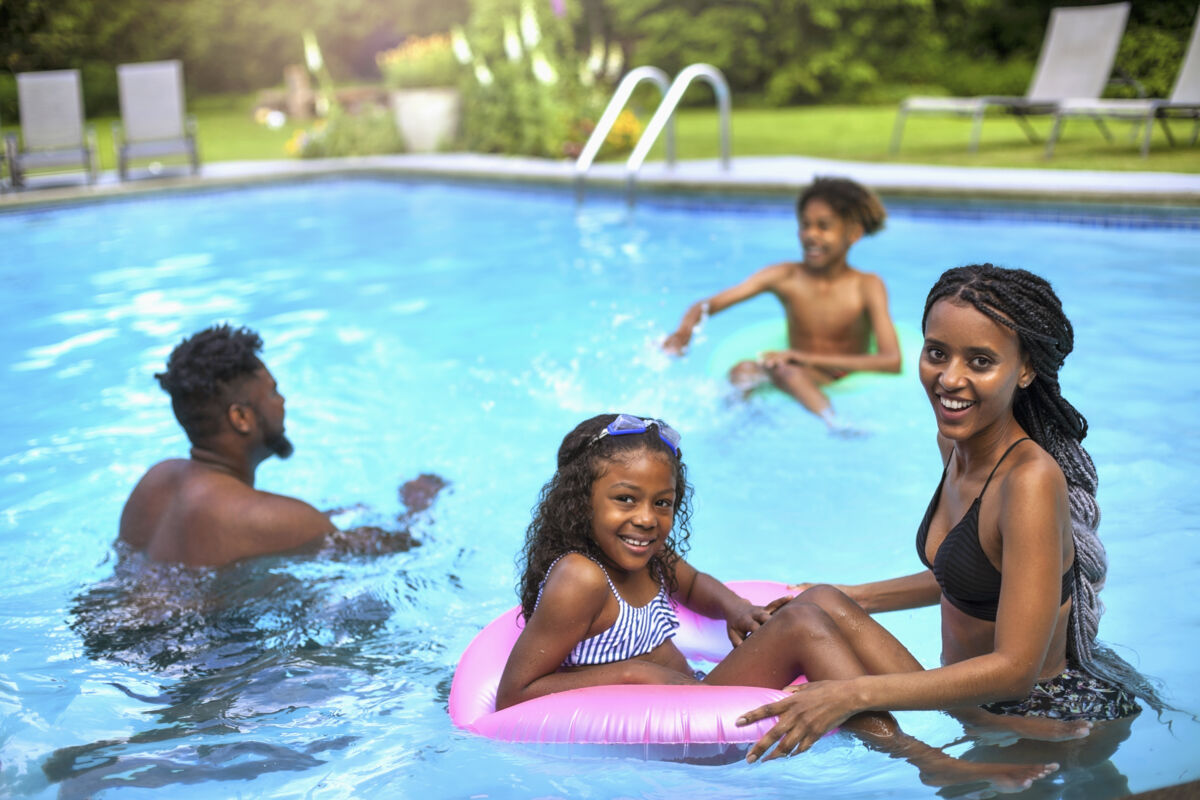 family enjoying outdoor pool