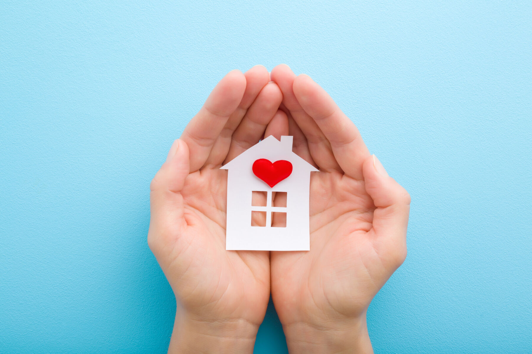 Hands Holding Home With Heart