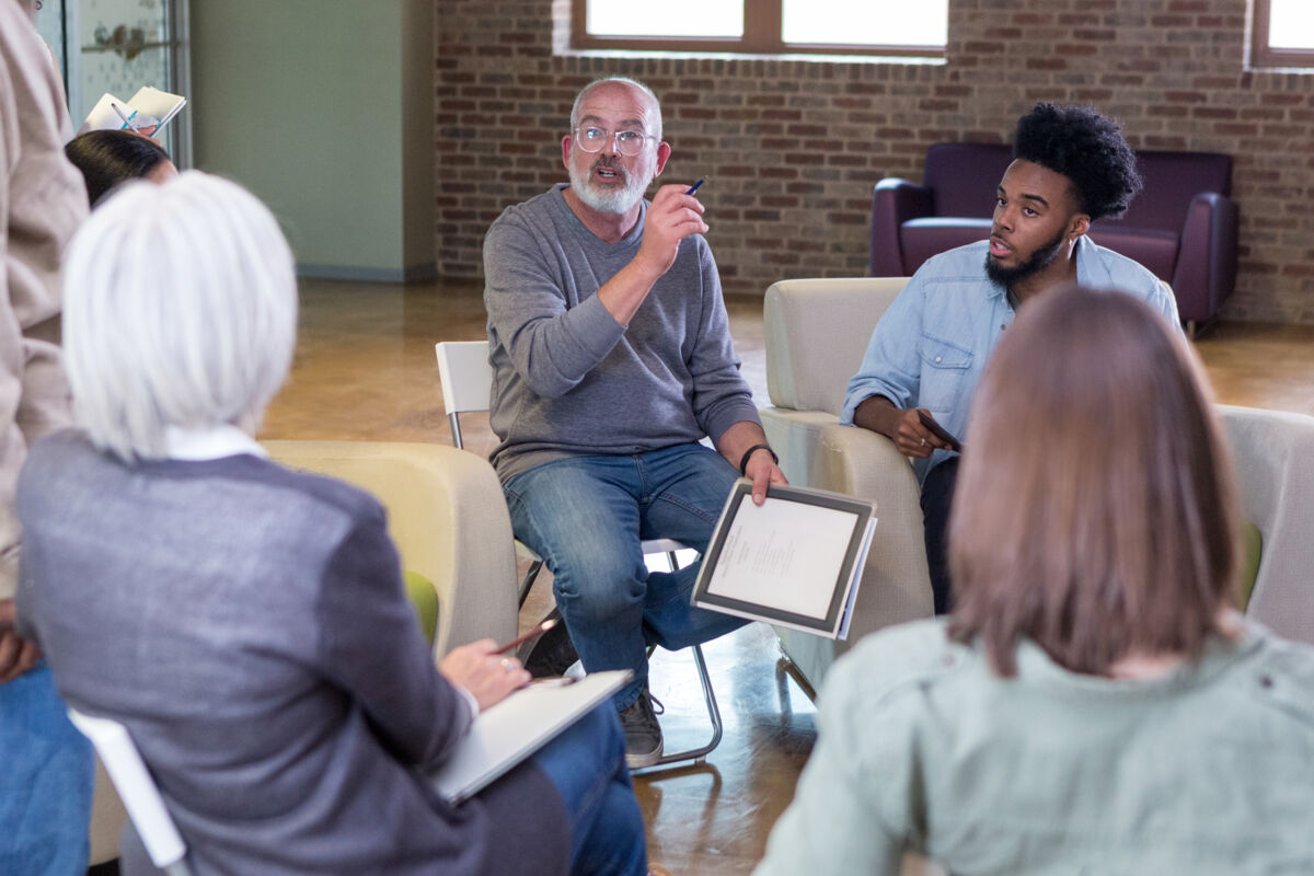 Man Leading Community Meeting