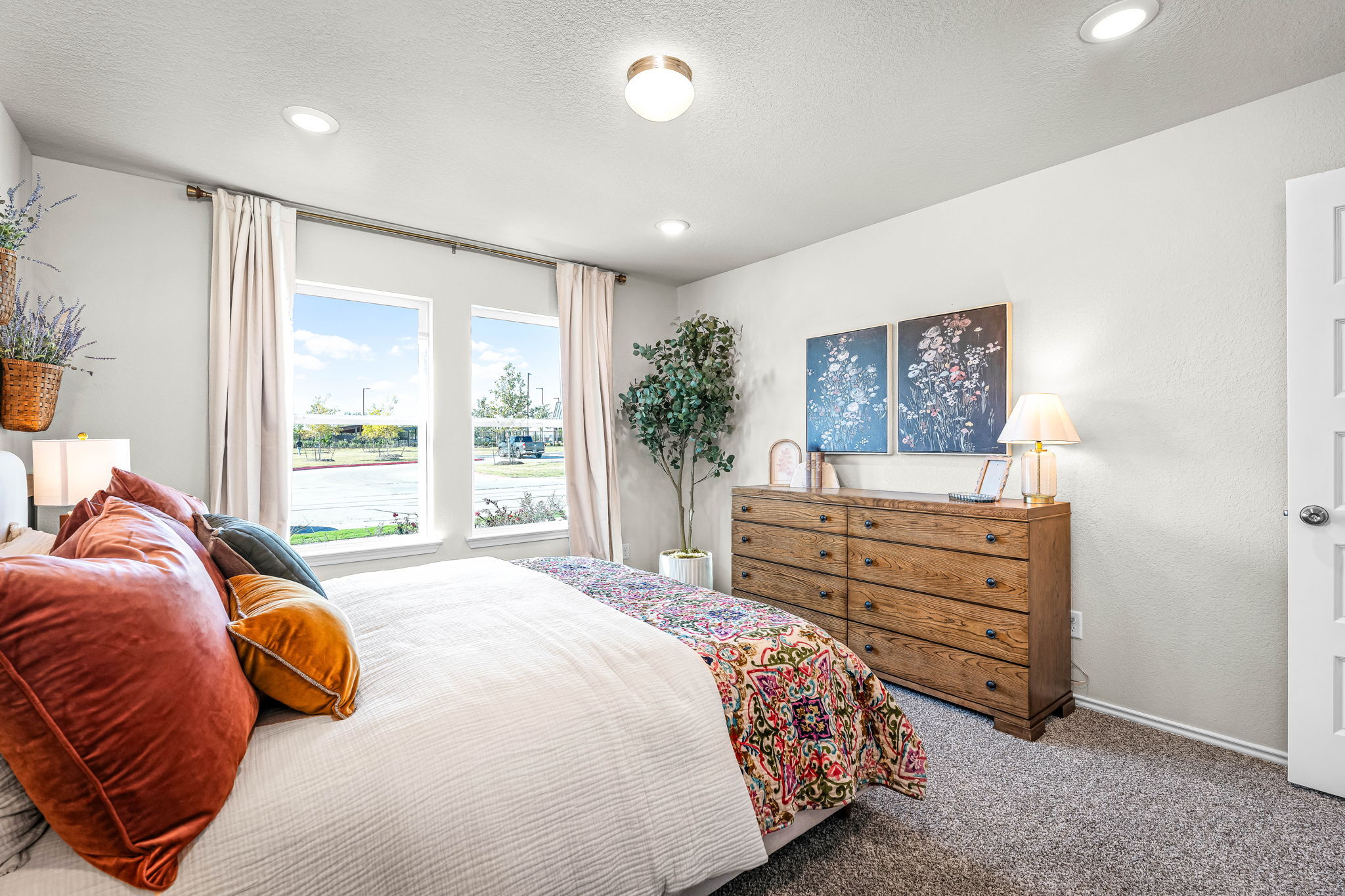These are the secondary bedrooms of the Hawkins plan and is the model home in Carillon at 13305 E...