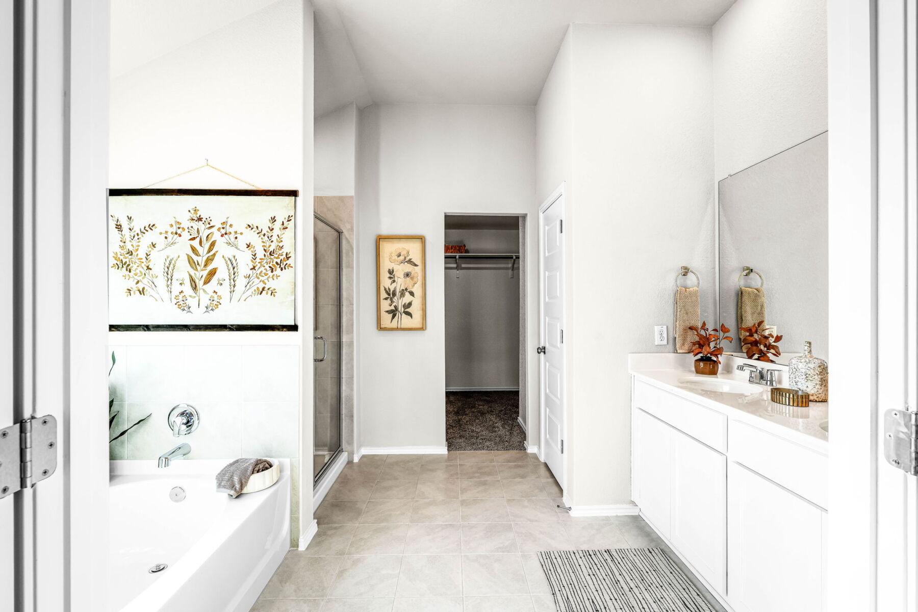 This is the primary bathroom of the Hawkins plan and is the model home in Carillon at 13305 Eppright Trace Blvd., Manor, TX.