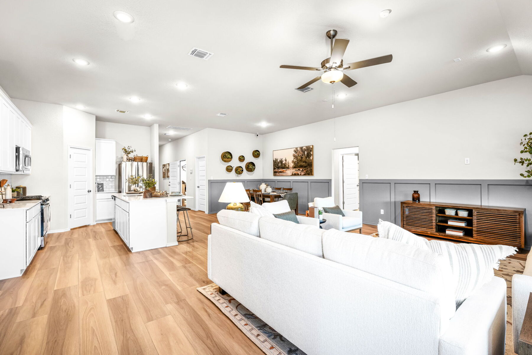 This is the living area of the Hawkins plan and is the model home in Carillon at 13305 Eppright Trace Blvd., Manor, TX.