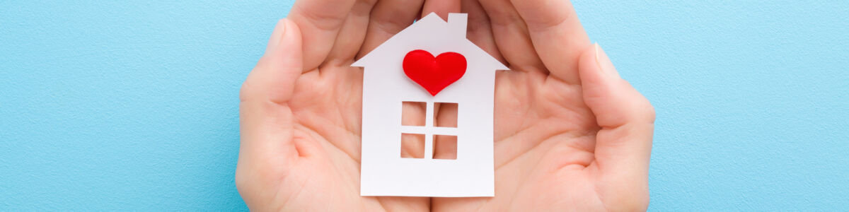 Hands Holding Home With Heart