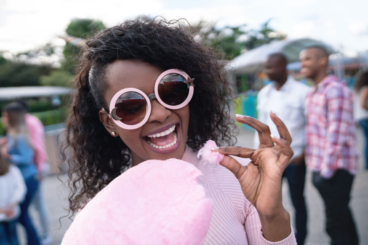 Woman Eating Cotton Candy