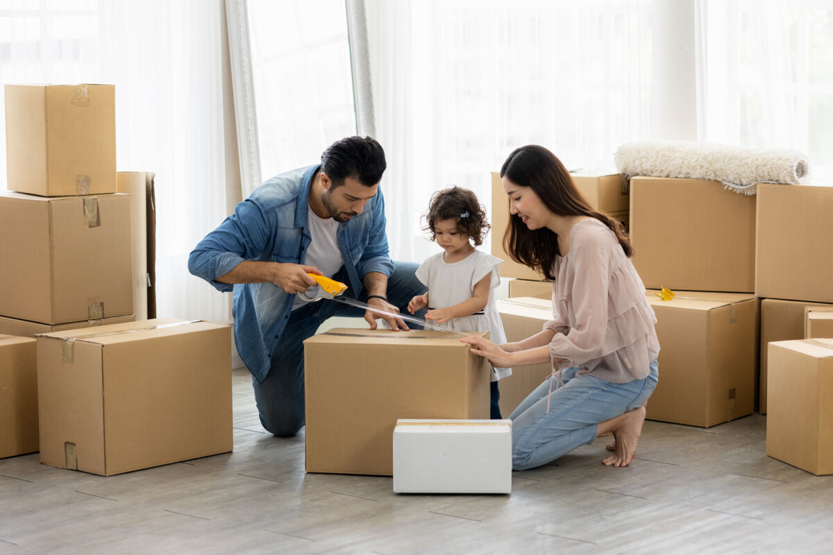 Family Packing Moving Boxes