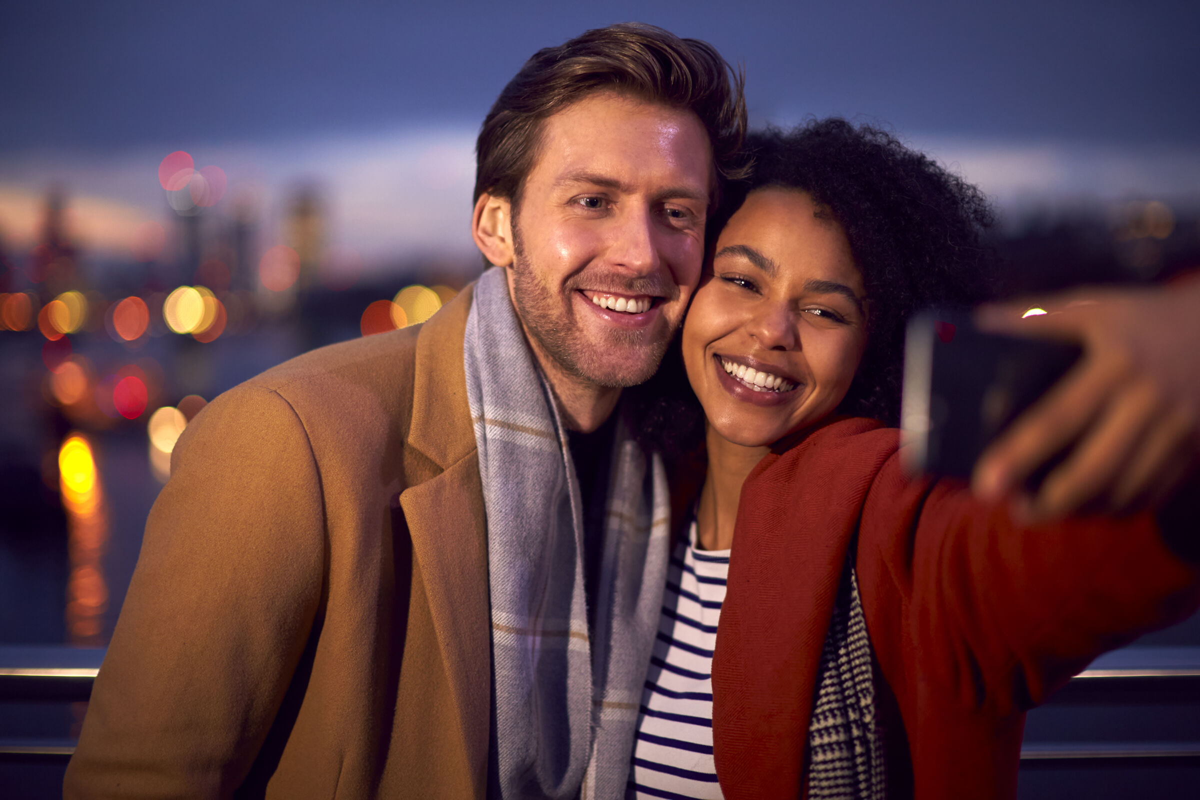 Couple Taking Selfie With Skyline Behind Them - Date Night