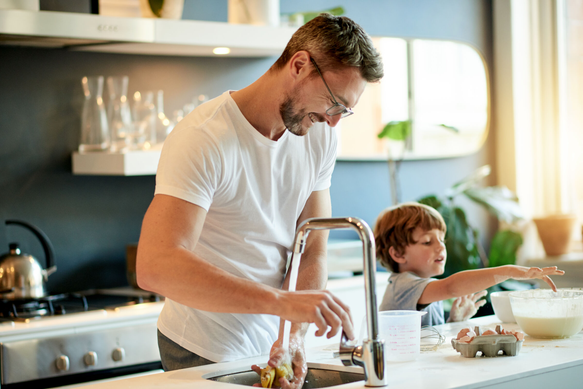 Father and Son Washing Dishes Together