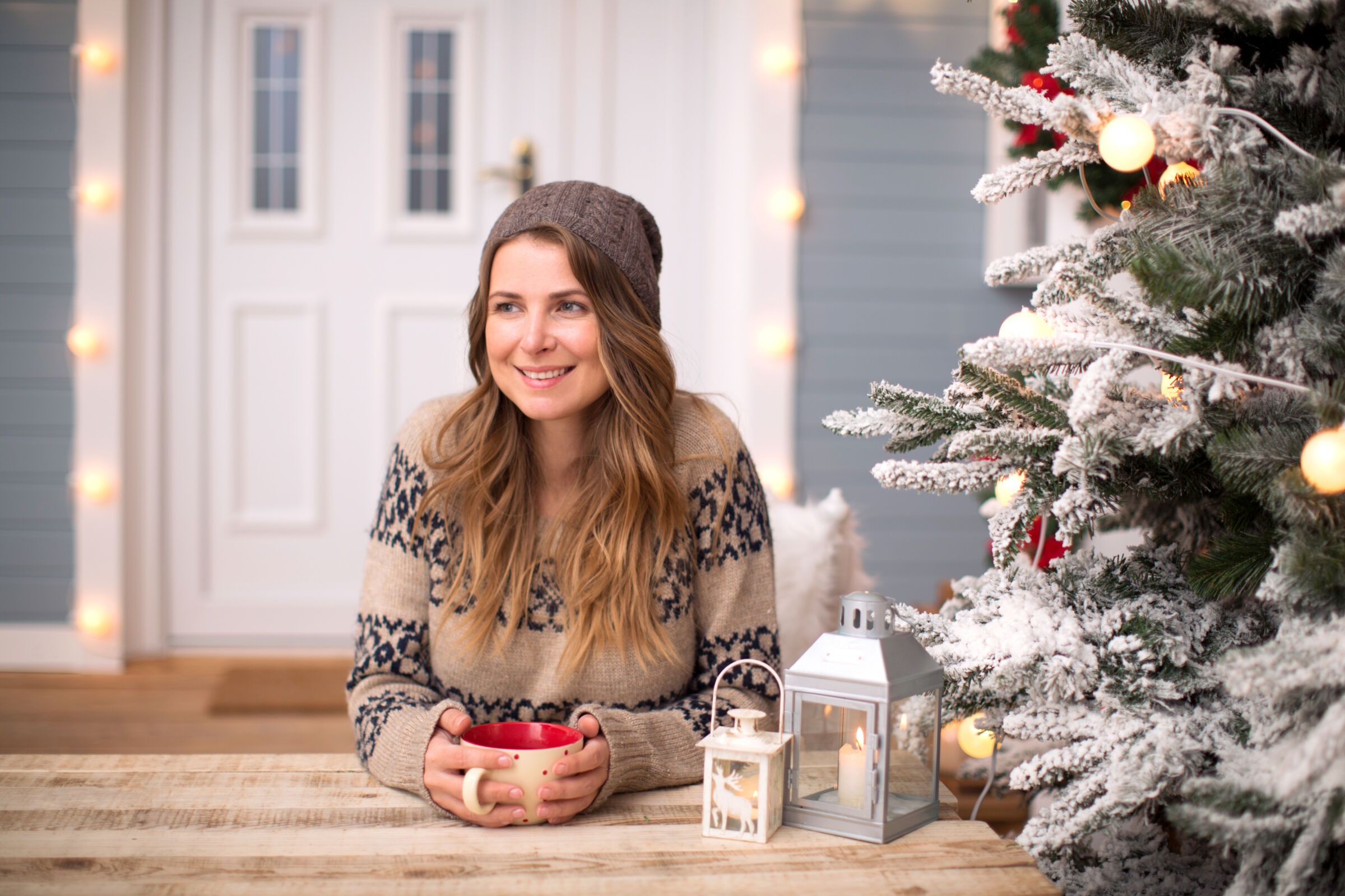 Woman sitting on porch in winter