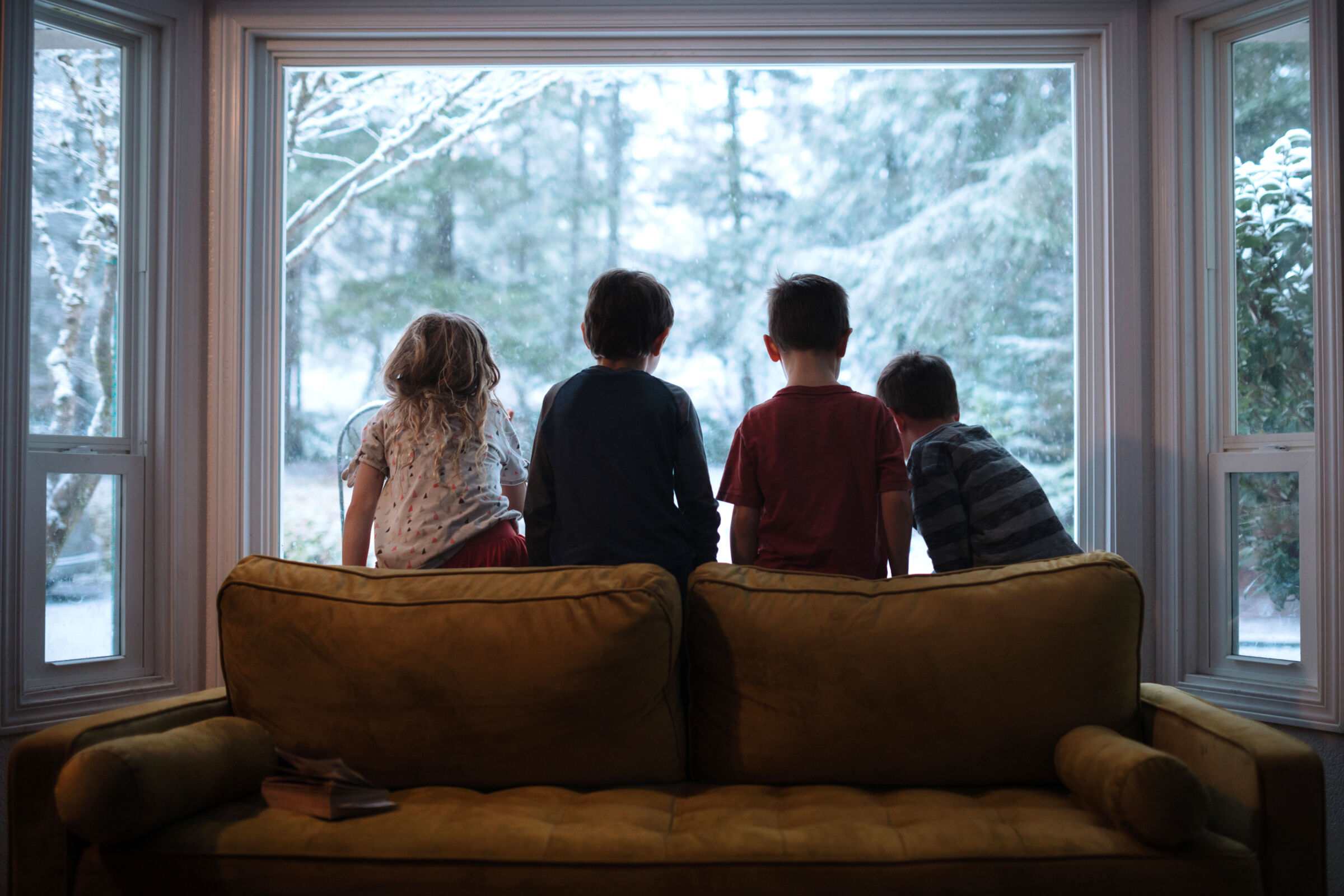 Kids Looking Out Window at Snow