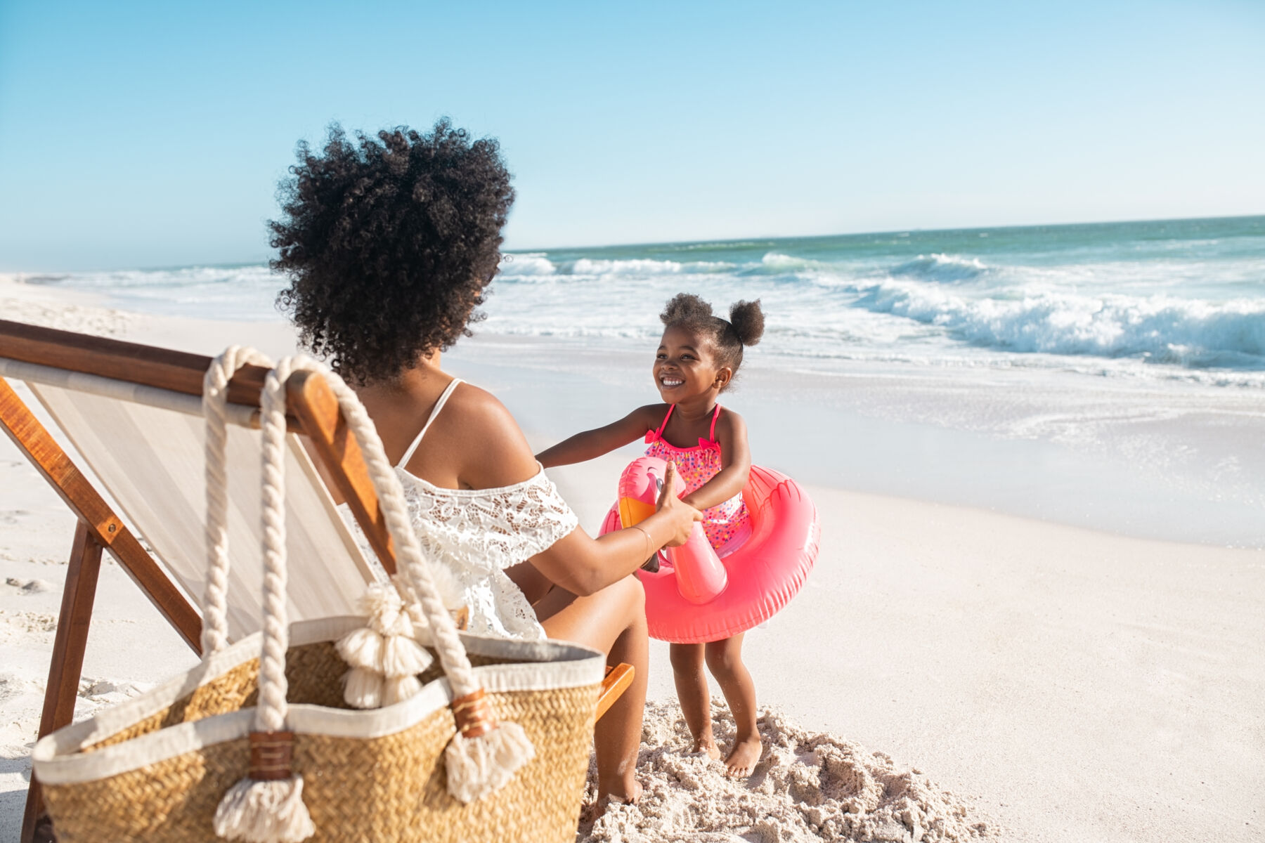 Mother and Daughter Playing on Beach